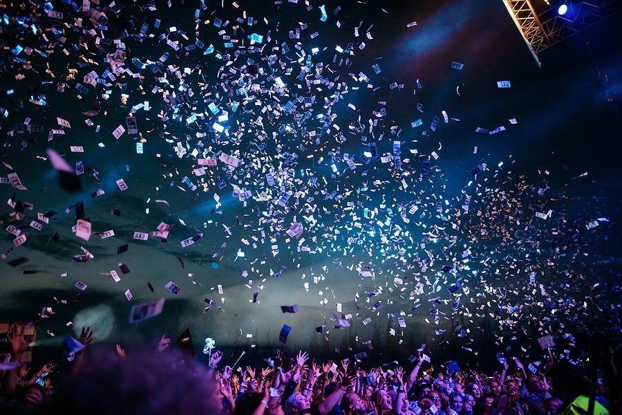 Confetti falling over a festival crowd