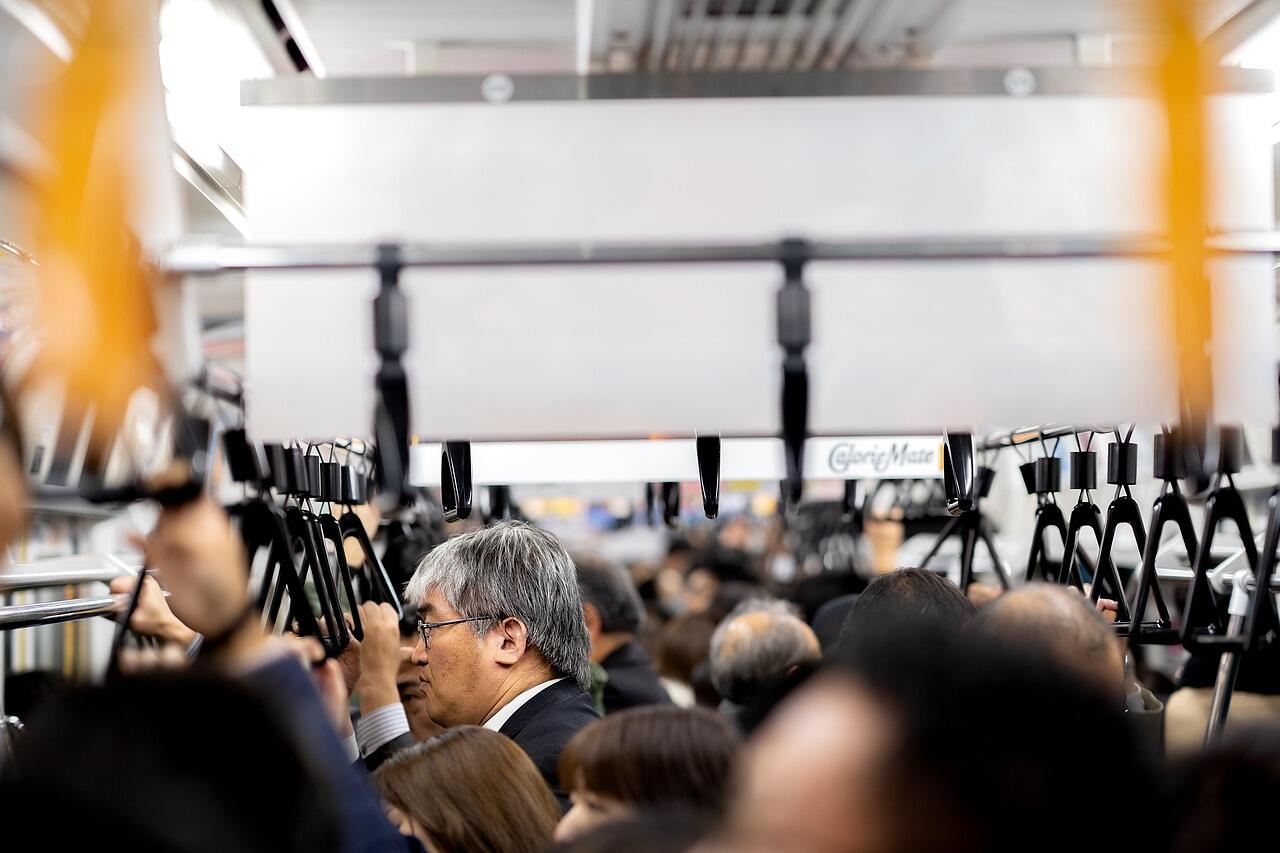 A seated audience filling a conference hall